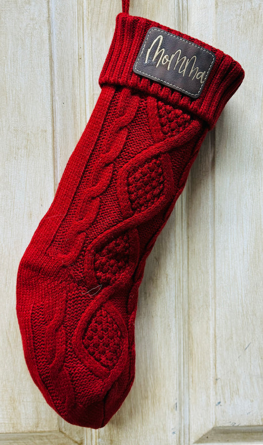 Knit Christmas stocking with leather patch